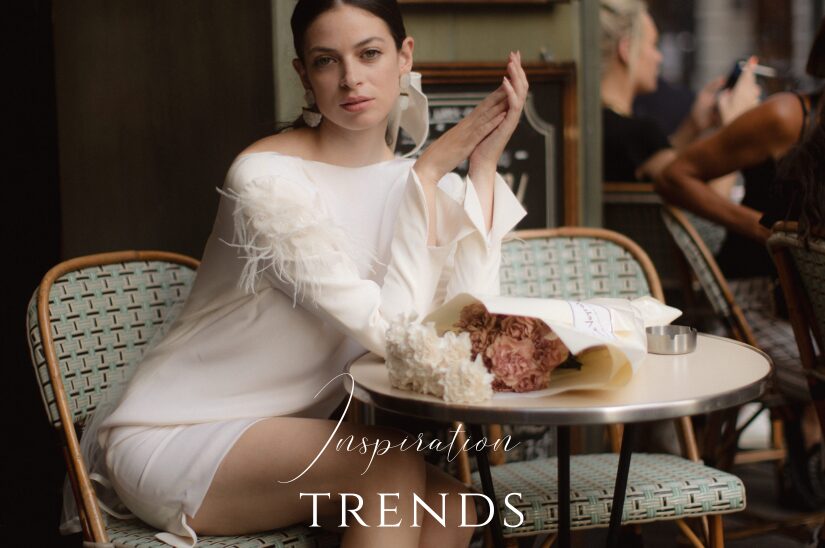 bride sitting in a cafe wearing a short wedding dress by london wedding dressmaker cynthia grafton-holt