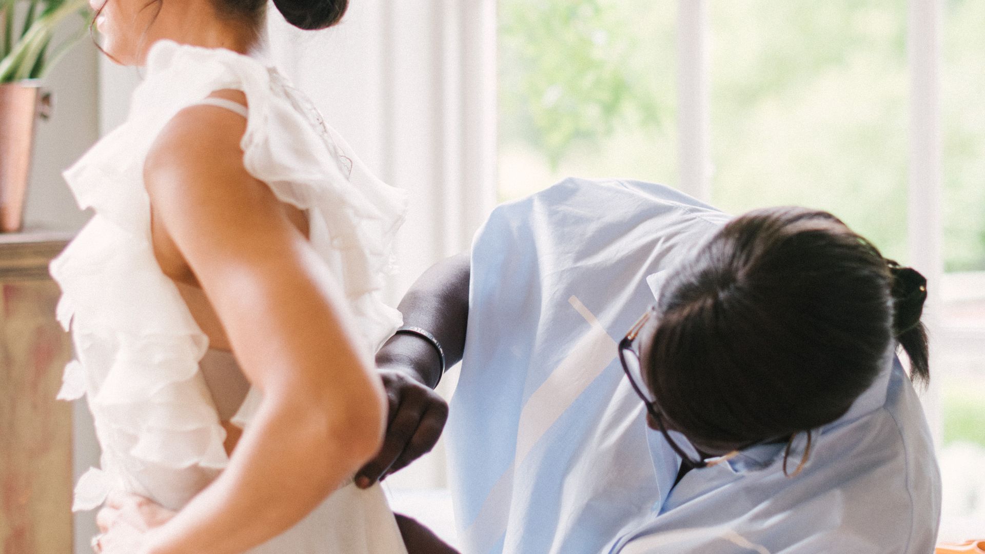 Assessing the fit and movement of wedding dress during bridal consultation